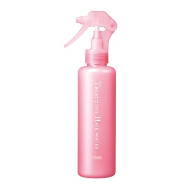 Pink spray bottle with a white label on a white background